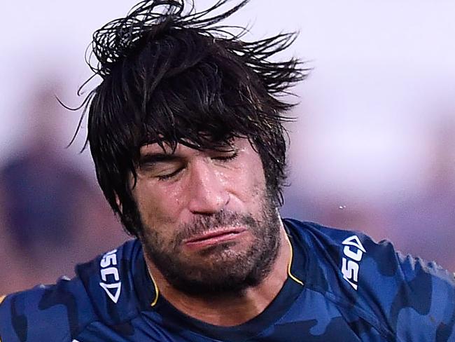 TOWNSVILLE, AUSTRALIA - APRIL 18: Manu Vatuvei of the Warriors is tackled by James Tamou of the Cowboys during the round seven NRL match between the North Queensland Cowboys and the New Zealand Warriors at 1300SMILES Stadium on April 18, 2015 in Townsville, Australia. (Photo by Ian Hitchcock/Getty Images)