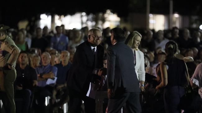 Australian Prime Minister Scott Morrison shaking hands with Labor Deputy Leader Richard Marles at the dawn service at Darwin Cenotaph War Memorial. Picture: Tim Hunter