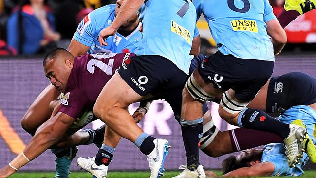 BRISBANE, AUSTRALIA - JUNE 02: Caleb Timu of the Reds scores a try during the round 16 Super Rugby match between the Reds and the Waratahs at Suncorp Stadium on June 2, 2018 in Brisbane, Australia.  (Photo by Albert Perez/Getty Images)