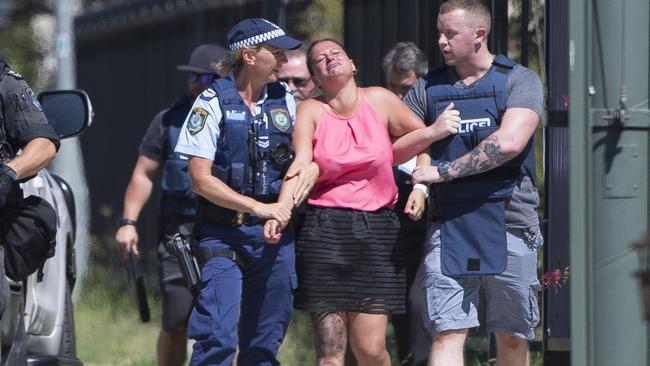 Chantelle Strnad is taken away by police from her western Sydney business that was the scene of a siege in March.