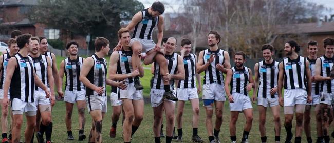 Lachie Roberts is chaired off by teammates after his 150th game Picture: ALISTAIR KNOX