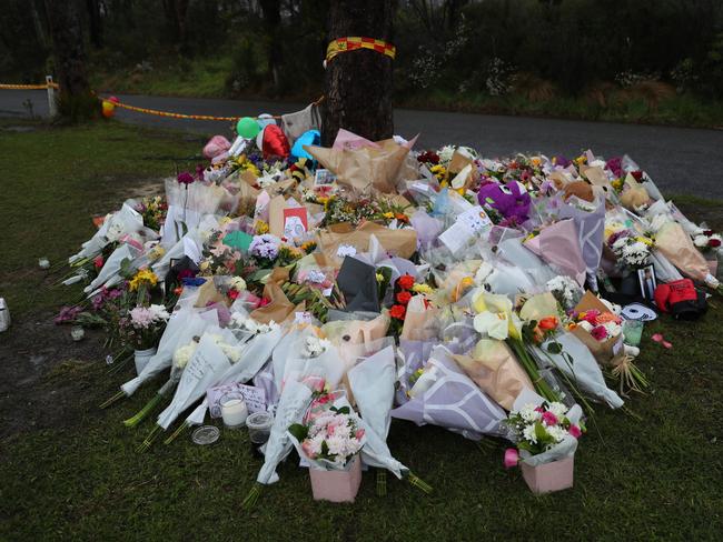 More flowers and tributes arrive with each day. Picture: John Grainger