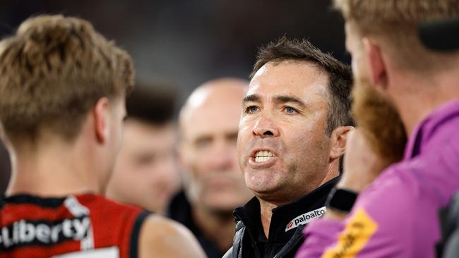 MELBOURNE, AUSTRALIA - MAY 25: Brad Scott, Senior Coach of the Bombers addresses his players during the 2024 AFL Round 11 match between the Richmond Tigers and the Essendon Bombers at The Melbourne Cricket Ground on May 25, 2024 in Melbourne, Australia. (Photo by Dylan Burns/AFL Photos via Getty Images)