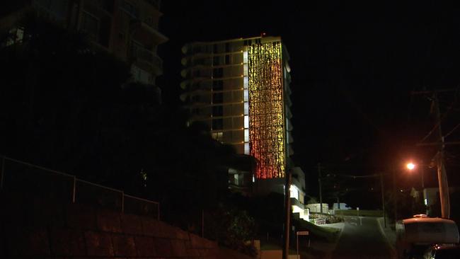 Photos of Lindy Lee's artwork which is on the side of the Awaken Residences tower in Rainbow Bay. Picture: Supplied