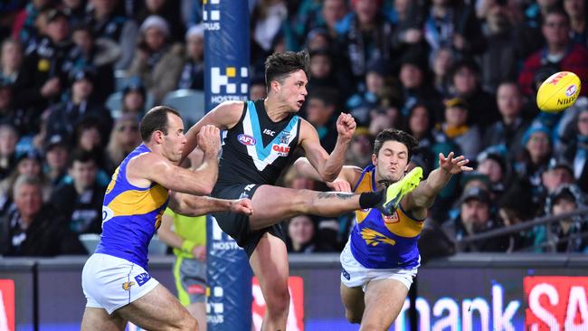 Aidyn Johnson kicks one of three goals for the Power. Picture: AAP Image/David Mariuz