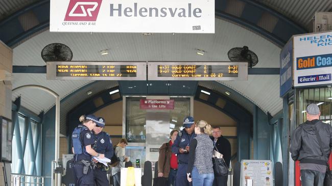 Police outside Helensvale Train Station at the end of an operation which saw a man was taken into custody after a series of threats were made across the rail network on the Gold Coast. Picture Glenn Hampson