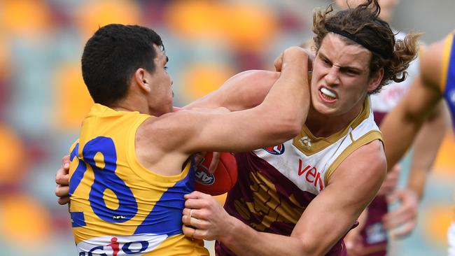 Eagle Thomas Cole can’t quite shake free from the clutches of Brisbane’s Jarrod Berry. Picture: AAP