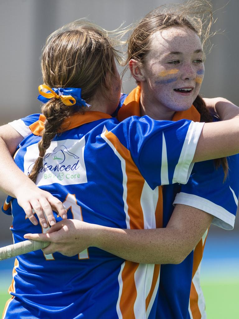 Newtown players Ruby Dakin (left) and Elizabeth Kelly celebrate defeating Rangeville in J2 girls grand final hockey at Clyde Park, Saturday, September 10, 2022. Picture: Kevin Farmer