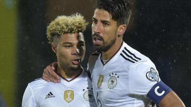 Germany's Sami Khedira (R) celebrates with his teammate Serge Gnabry.