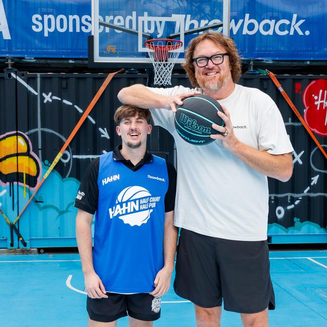 Australian NBA legend Luc Longley with Hoops Capital Program player Mitchell Watson at the half court outdoor bar and basketball court at the Entertainment Quarter, Moore Park. Photo: Max Mason-Hubers