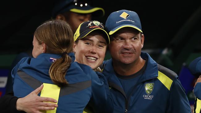 Matthew Mott celebrates with Ellyse Perry and Tayla Vlaeminck.