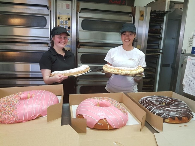 Emma Riggs and Jamie Thomas from Northern Beaches Bakehouse show off their oversized treats.