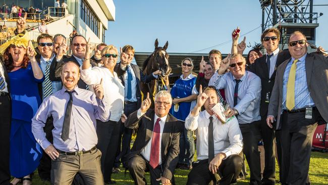 Connections of Music Magnate celebrate after winning the Doomben 10,000. Picture: AAP