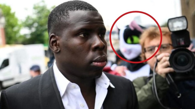 Kurt Zouma outside court on Wednesday, pursued by a cat