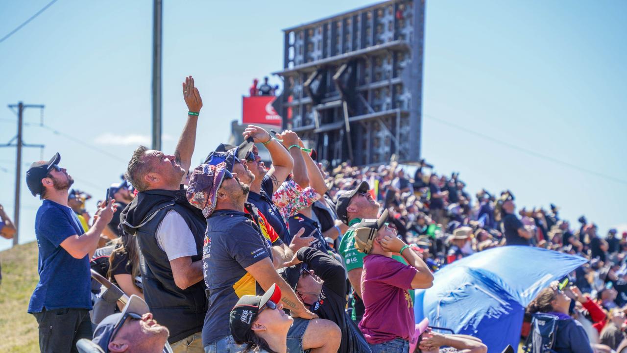 Spectators look to the sky to get a glimpse of the spectacular display. Picture: NCA NewsWire/ Henry Derooy