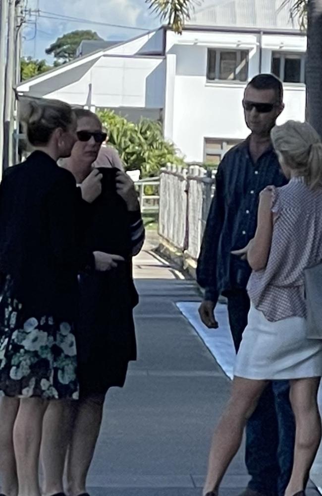 Cindy Lee and James Wallace Tree (back wearing sunglasses) stand outside Mackay courthouse with their legal representation (front). Mr Tree has pleaded not guilty to dog fighting charges, which both have pleaded not guilty animal negligence charges.