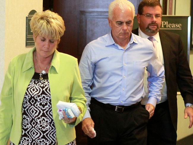 Casey’s parents, Cindy and George Anthony, parents of Casey Anthony, leave court with their lawyer Mark Lippman (right) after their daughter was found not guilty of Caylee’s murder.