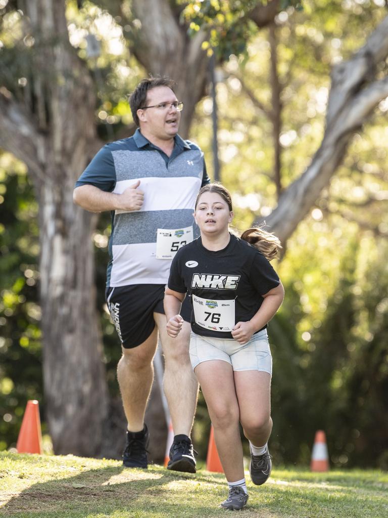 Chelsea Richards finishes the 2km. Top of the Range adventure trail run at Picnic Point. Sunday, April 2, 2023. Picture: Nev Madsen.