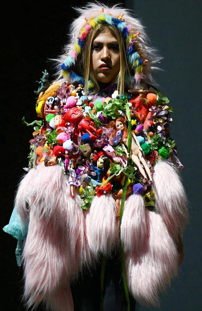 A model poses in recycled material and usable waste during a fashion and sustainability event in Bogota. Picture: Raul Arboleda/AFP