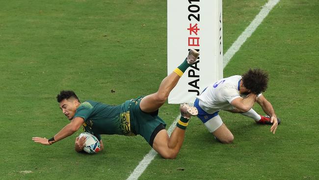 Jordan Petaia scores a try during the Rugby World Cup 2019 Group D game between Australia and Uruguay.