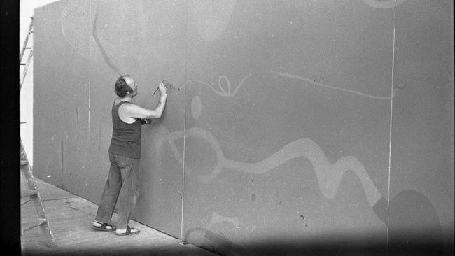 John Olsen painting the Salute to Five Bells mural.