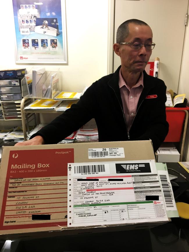 The Australia Post branch master in Sydney with the package on its way to Number 10 in London. Picture: Charles Miranda