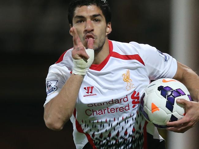 Liverpool's Luis Suarez celebrates after scoring his side's third goal, during the English Premier League soccer match between Crystal Palace and Liverpool at Selhurst Park stadium in London, Monday, May 5, 2014. (AP Photo/Alastair Grant)