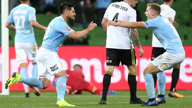 Melbourne City’s Bruno Fornaroli, left, celebrates his goal against Wellington with Riley McGree. Picture: AAP