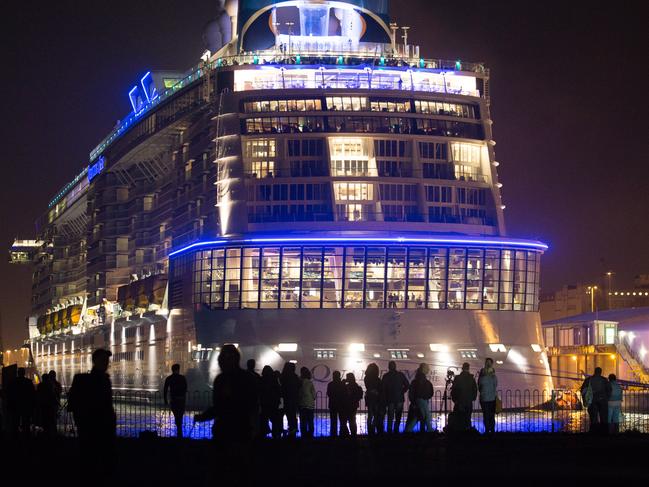 SOUTHAMPTON, ENGLAND - OCTOBER 31: People gather to see the cruise ship Quantum of the Seas which is currently docked at Southampton on October 31, 2014 in Southampton, England. Billed as the world's first smartship, Royal Caribbean's Quantum of the Seas is claimed to be the most high-tech cruise ship in the world, with high tech modifications such as virtual balconies in windowless rooms and features such as the first dodgem ride on water, and a skydiving simulator. The ship will shortly begin its voyage from Southampton, where it docked earlier this week, to New York before relocating to the Caribbean for the 2014-15 season. (Photo by Matt Cardy/Getty Images)