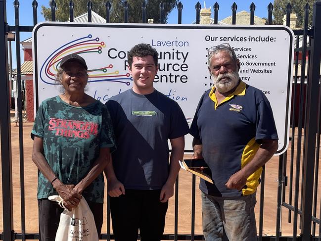 Curtin University student  Anthony Ferraro (C) with two members of the community in Laverton WA after assisting them with their tax affairs in the university's tax clinic program.