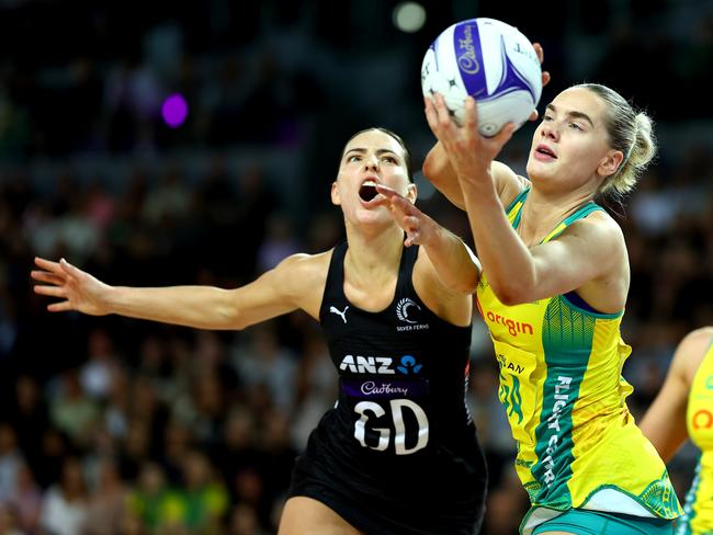 Diamonds goal attack Kiera Austin takes the pass ahead of NZ’s Karin Burger. Picture: Getty Images