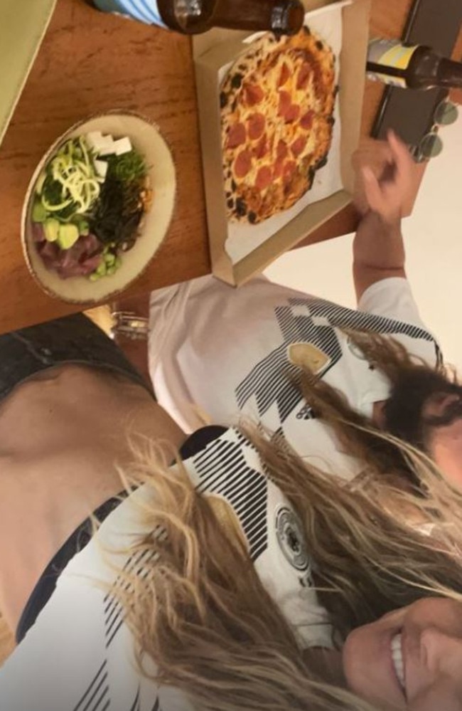 She shared this snap of herself enjoying some pizza and beers. Picture: Instagram/heidiklum