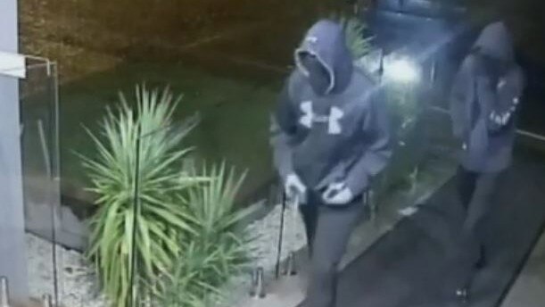 Two suspects walking towards the front door of The Peninsula at Nelson Bay before it was broken into in the early hours of March 16. Picture: supplied