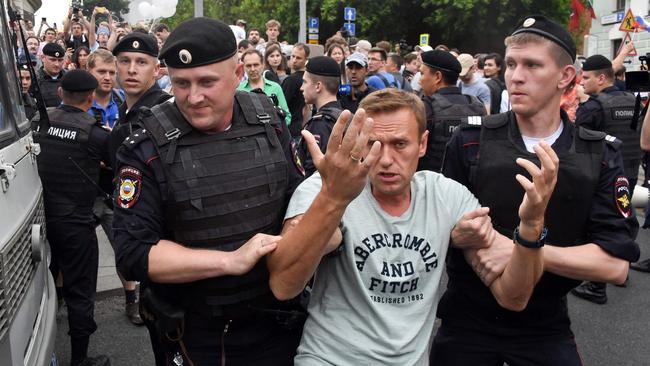 Detained by Russian police officers during a 2019 march to protest against the alleged impunity of law enforcement agencies in central Moscow. Picture: AFP