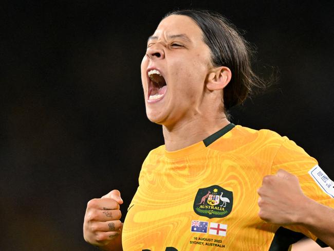 FILES-- This file photo taken on August 16, 2023 shows Australia's forward Sam Kerr celebrating scoring her team's first goal during the Australia and New Zealand 2023 Women's World Cup semi-final football match between Australia and England at Stadium Australia in Sydney. Chelsea and Australian women's football star Sam Kerr has been charged with a "racially aggravated offence" in Britain following a dispute involving a police officer, London's Metropolitan Police said March 4. The 30-year-old striker, one of the highest profile and best-paid players in the women's game, was charged following an incident in London in January 2023, a police statement read. (Photo by IZHAR KHAN / AFP)