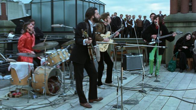 The Beatles performing in a rooftop scene from 'The Beatles: Get Back', a docuseries released on Disney Plus in 2021. Picture: Apple Corps Ltd.