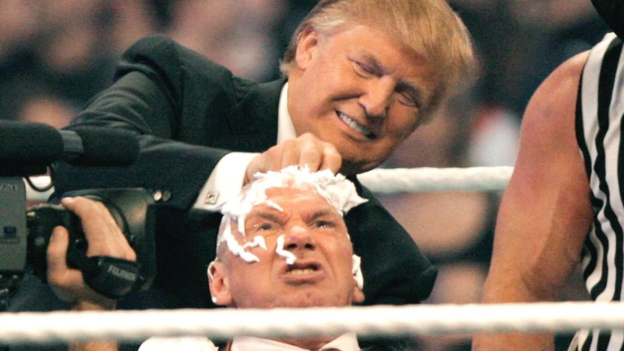 WWE chairman Vince McMahon (C) has his head shaved by Donald Trump after losing a bet in the Battle of the Billionaires at the 2007 World Wrestling Entertainment's Wrestlemania at Ford Field 01 April 2007 at Ford Field in Detroit, Michigan. Bill Pugliano/Getty Images/AFP =FOR NEWSPAPERS, INTERNET, TELCOS AND TELEVISION USE ONLY=