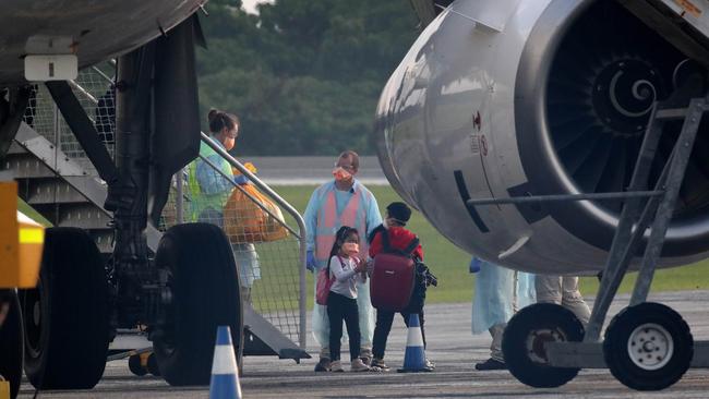 Wuhan refugees arrive at Christmas Island Airport yesterday. Picture: Colin Murty