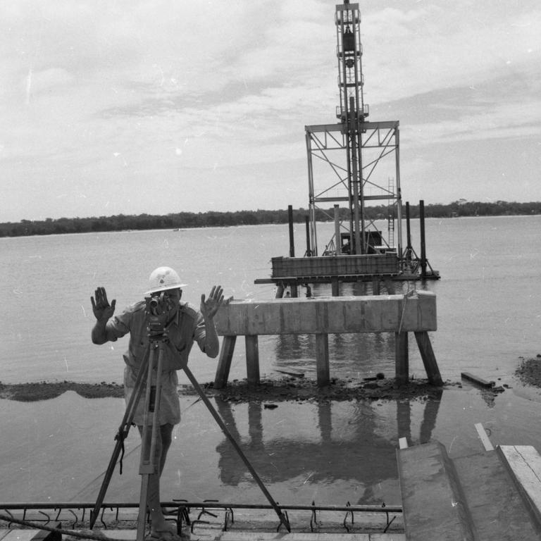 2/3/1962. A surveyor working on the Bribie Island Bridge. The bridge, over Pumicestone Passage, was completed in 1963 to provide the island with its first fixed link to the mainland. Picture by Jim Fenwick The Courier-Mail.