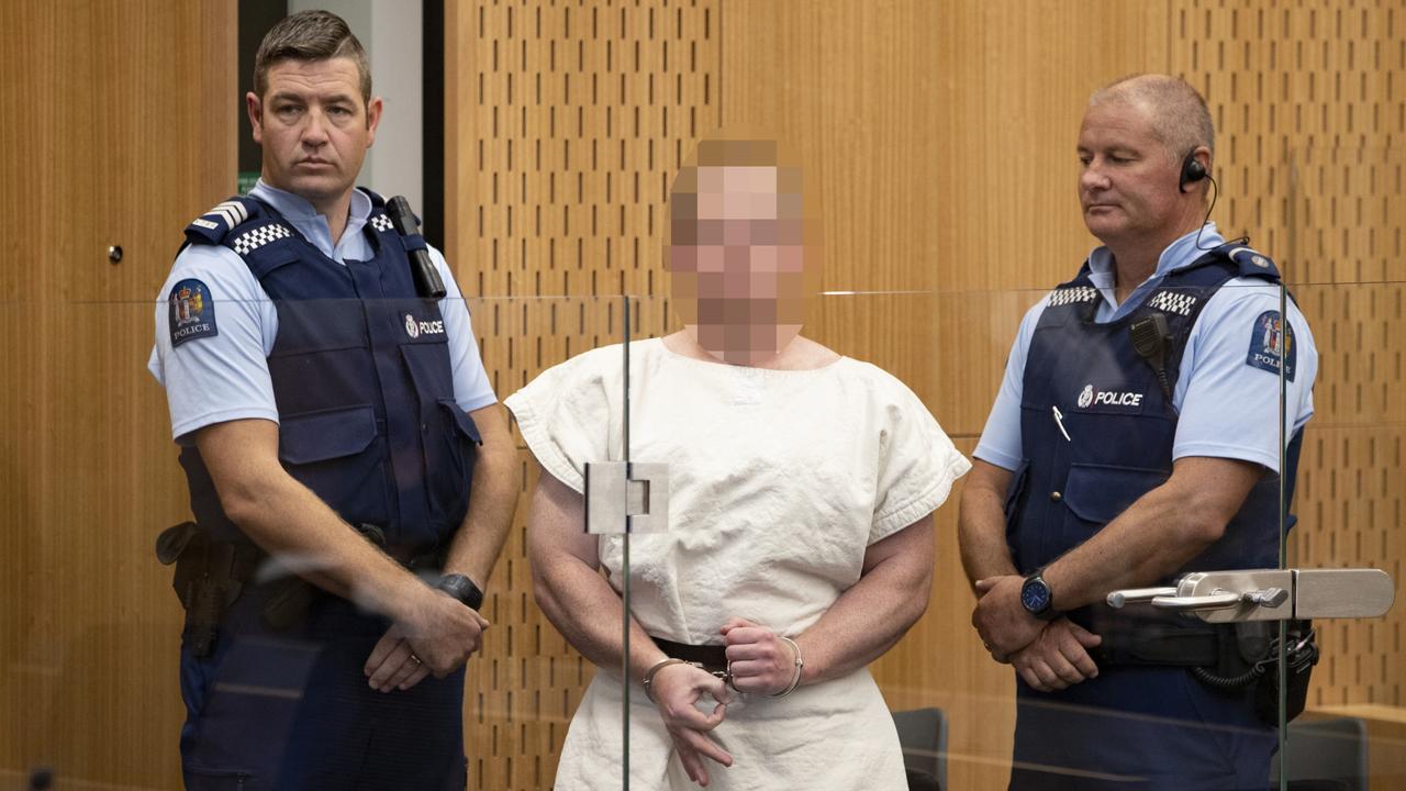 Brenton Tarrant making a sign to the camera during his appearance for murder in the Christchurch District Court. Picture: Mark Mitchell