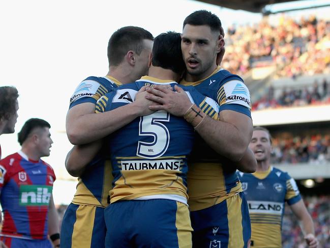 Haze Dunster of the Eels celebrates his try with teammates during the round 13 NRL match against the Newcastle Knights. Picture: Ashley Feder/Getty Images