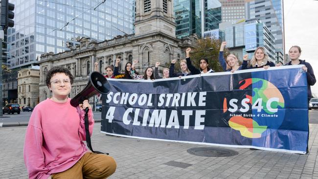 Audrey Mason-Hyde, left, prepares for the School Strike 4 Climate with fellow participants Tom, Rowan, Rosie, Anjali, Tabitha, Imogen, Maria, Grace, Charlotte and Alice in Victoria Square. Picture: Brenton Edwards