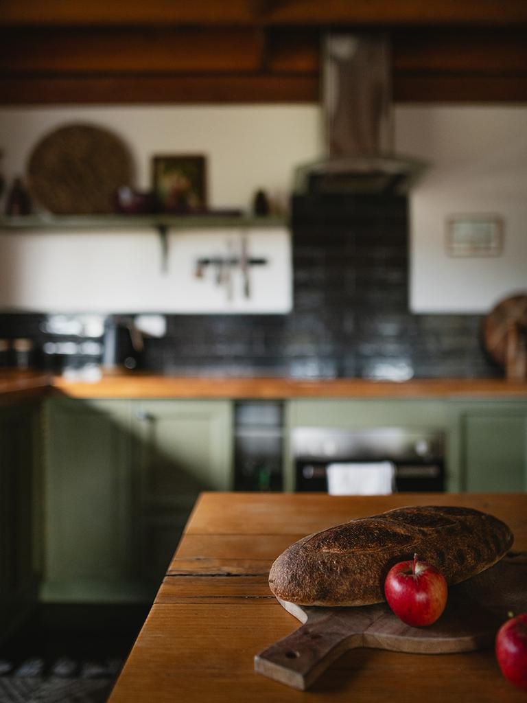 The kitchen at Orchards Nest, complete with fresh apples from the nearby orchard. Picture: Elle-May Watson