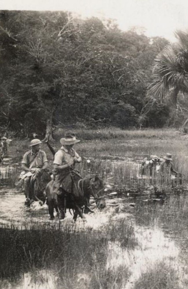 Malaria-ridden swamps … the stranded airmen crossing the River Kapsali, Dutch Timor in February 1942.