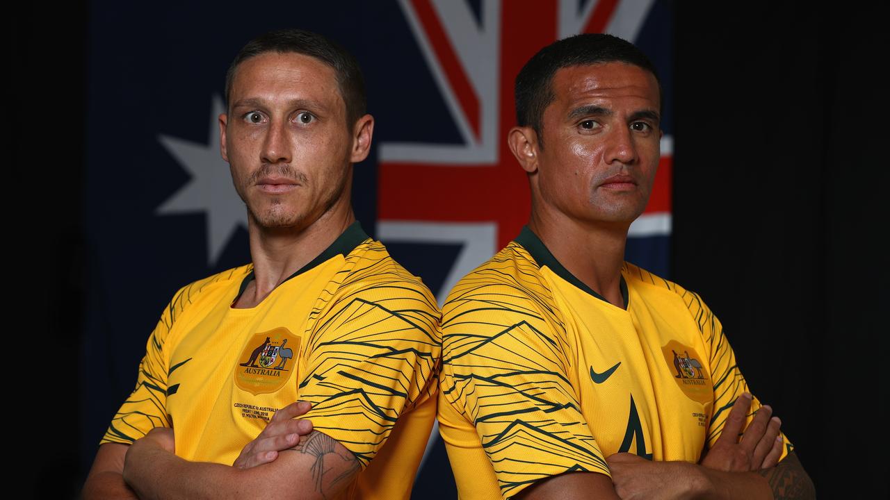 Mark Milligan and Tim Cahill of Australia