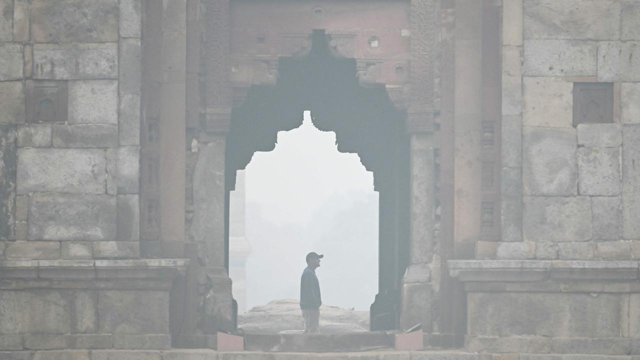 A man visits the Lodhi gardens on a cold smoggy morning in New Delhi on November 18, 2024. Picture: AFP