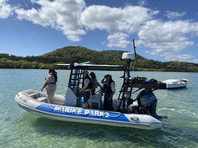 Rangers search for the suspected crocodile off the Redland Coast.