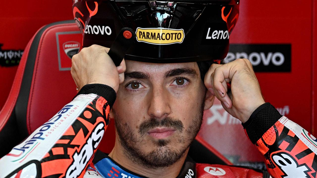 Ducati's Italian rider Francesco Bagnaia adjusts his helmet in his box during the second practice session of the San Marino MotoGP Grand Prix at the Misano World Circuit Marco-Simoncelli in Misano Adriatico, on September 6, 2024. (Photo by GABRIEL BOUYS / AFP)