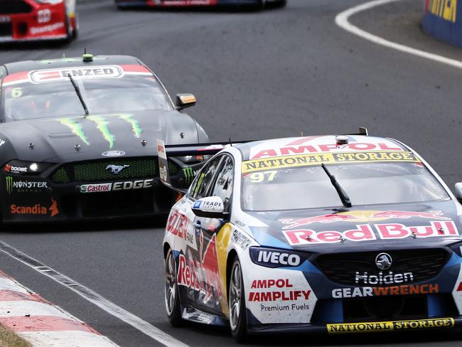DAILY TELEGRAPH - Pictured is Shane Van Gisbergen in his Redbull Holden Commodore leading the pack across the top of the mountain during the Supercheap Auto Bathurst 1000 at Mount Panorama Raceway today. Picture: Tim Hunter.