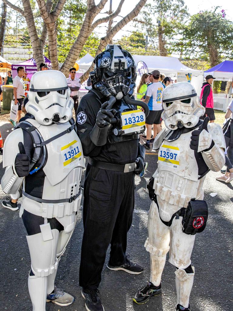 Justin McKeering from Wavell Heights, Michael Wright from Browns Plains and Adam Lochowicz from Gold Coast at the Bridge to Brisbane 2019 at South Bank, Sunday, August 25, 2019 (AAP Image/Richard Walker)